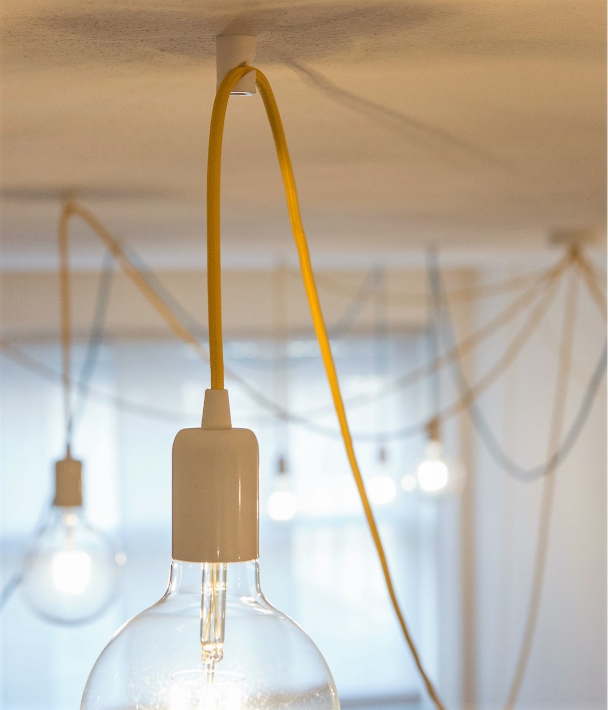 Crochet de décentralisation en matière plastique transparent